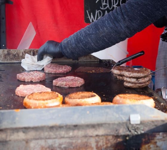 Prague burgers cooking at a market