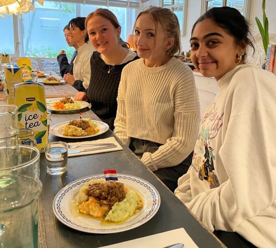students eat dutch meal abroad amsterdam