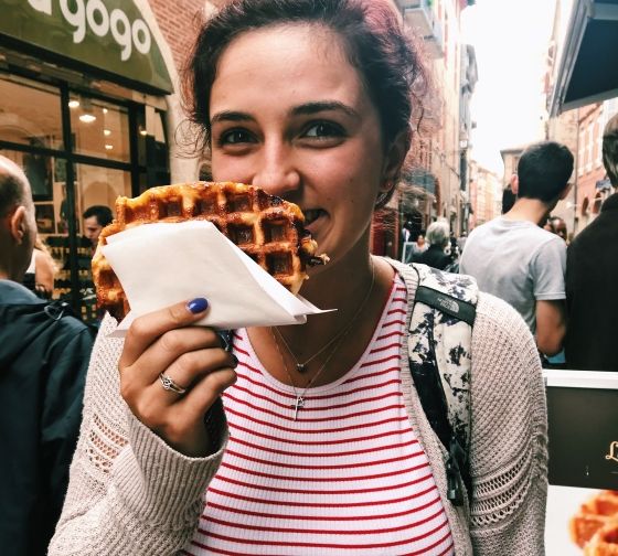 toulouse student eating a street waffle