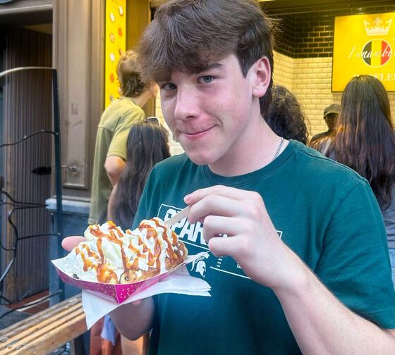 brussels-meals-student-enjoying-belgian-street-waffle