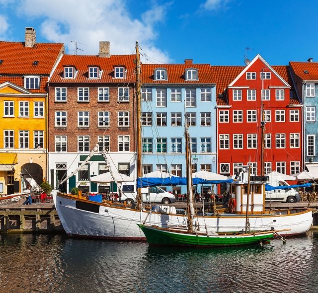 Copenhagen boats in canal by houses