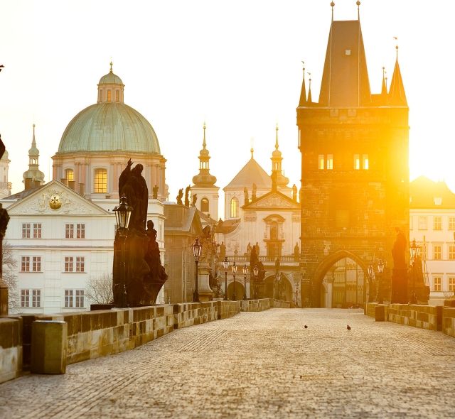 Prague Charles Bridge statues at sunrise