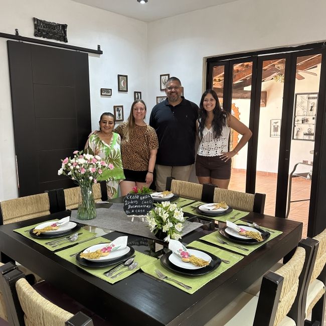 Standing around the table for a host family lunch