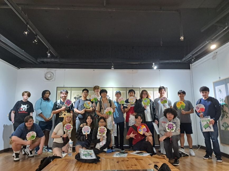 Group photo at a fan-painting event