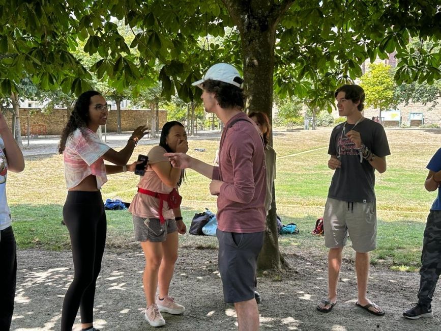 Students playing a game in the park and laughing