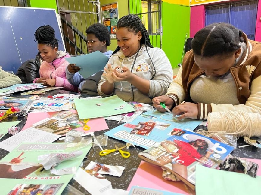 Facilitating a vision board workshop for high school holiday club. 