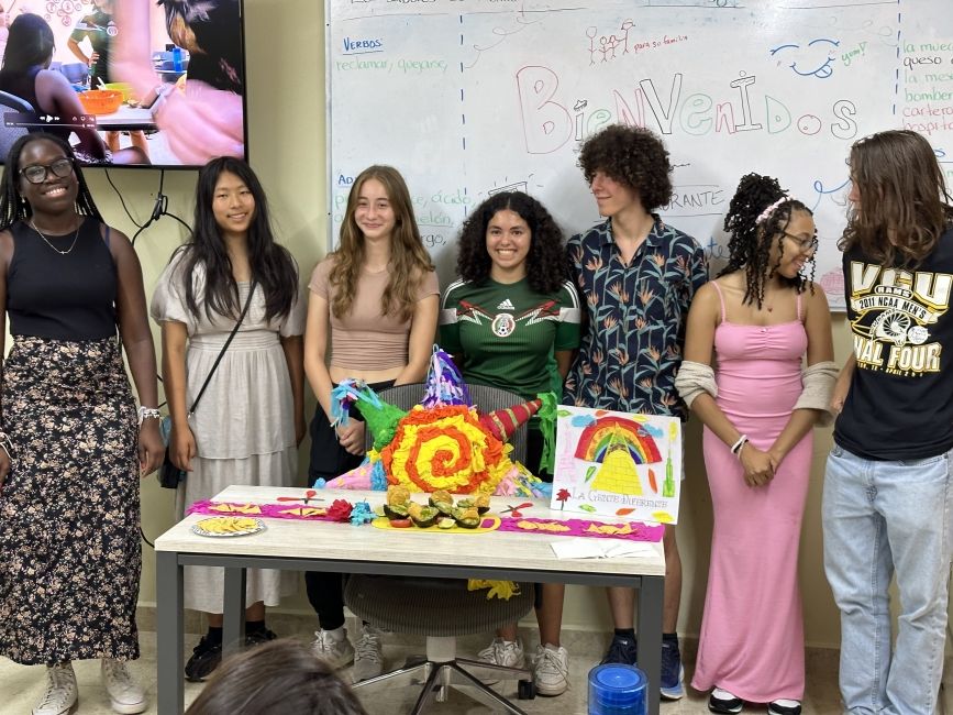 Students proudly standing with their guac