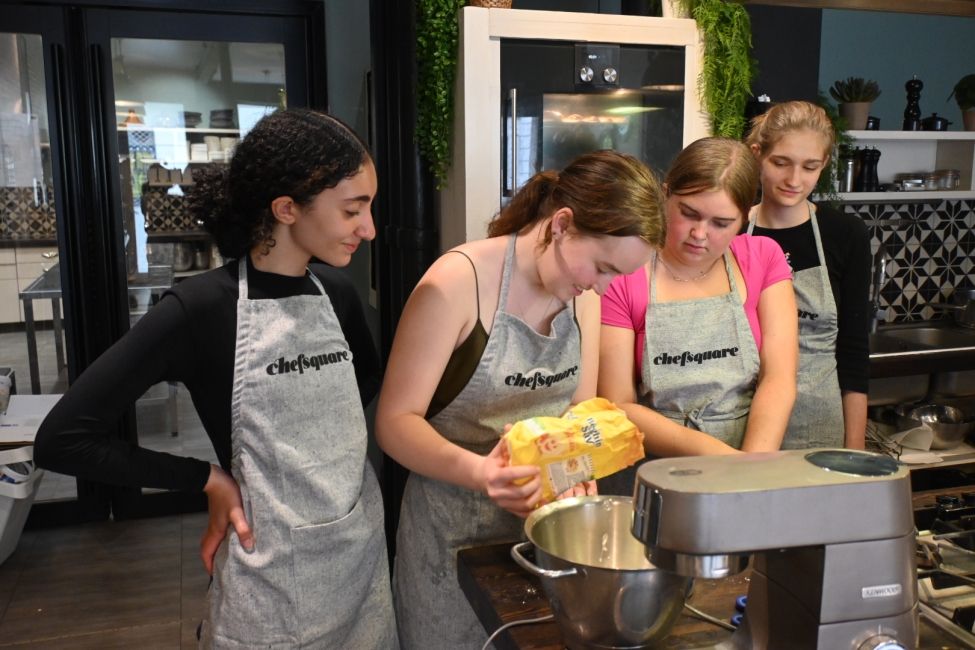 Pouring flour into a mixer