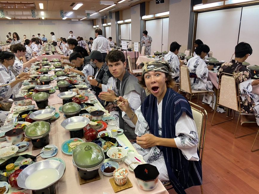 Students enjoy a meal at the ryokan