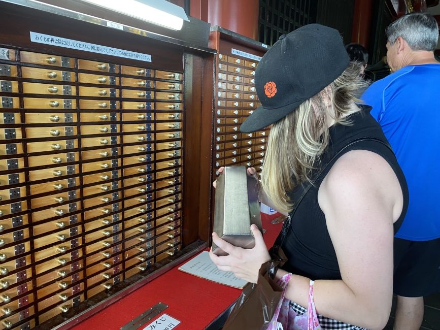 Student getting their fortune at Sensōji Temple