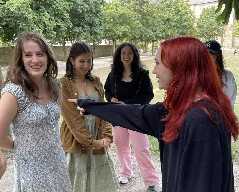 Girls standing and playing a game in the park