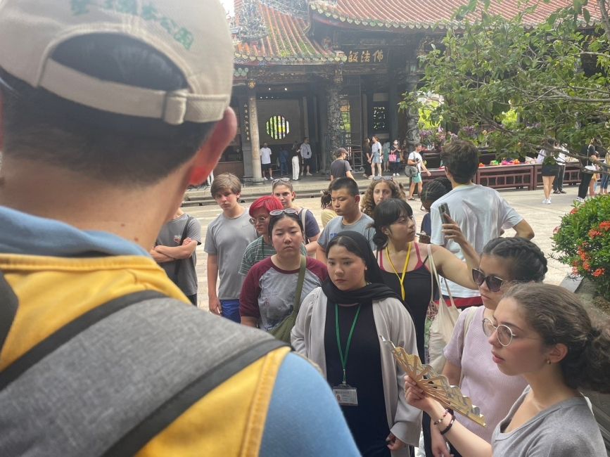 with the tour guide inside the temple 