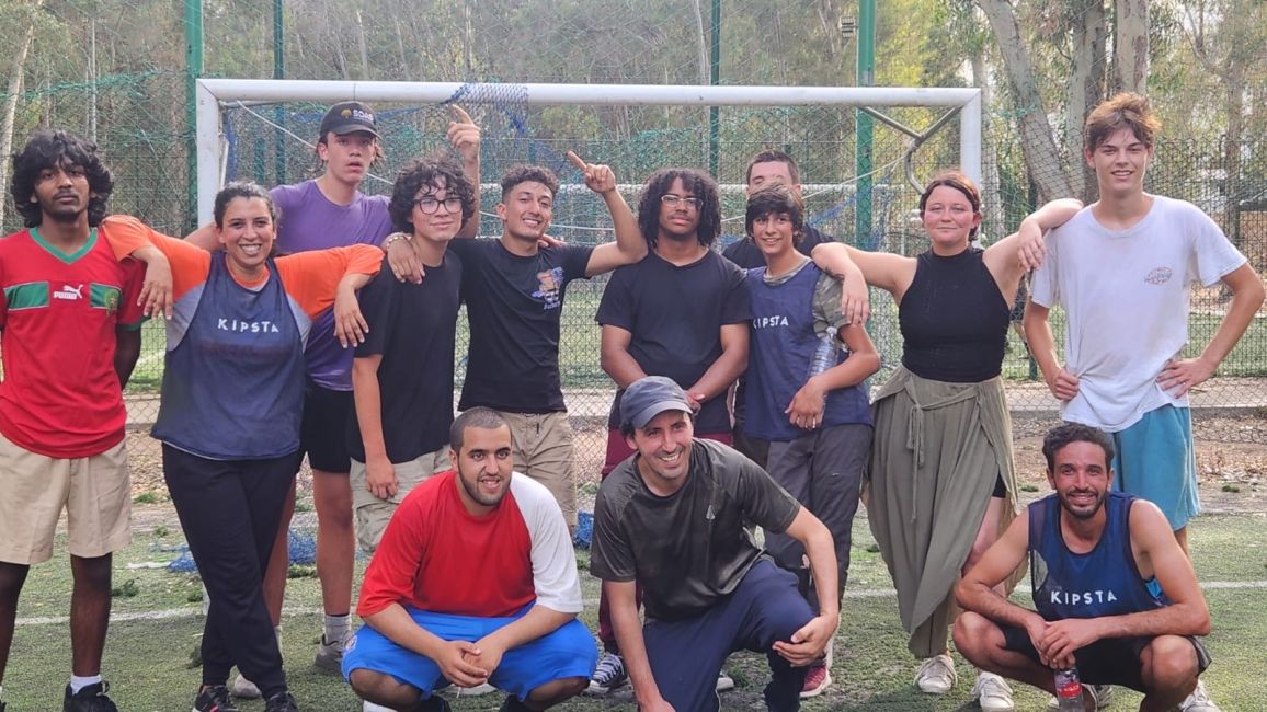 CIEE students standing for a picture in front of a soccer goal at Rabat's Hilton Park