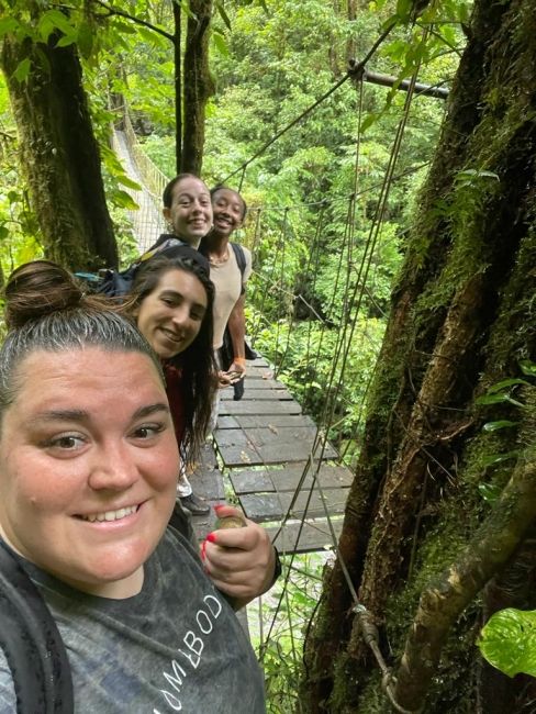 Program Leaders, Katherine and Alessandra, with Sarabelle and SaMyra crossing one of the many bridges.