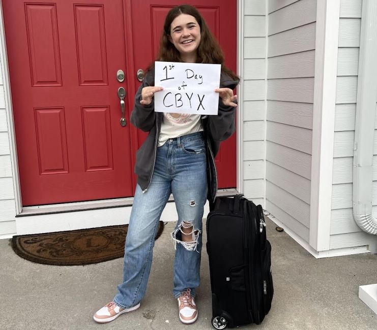 Standing in front of my house before leaving for the airport