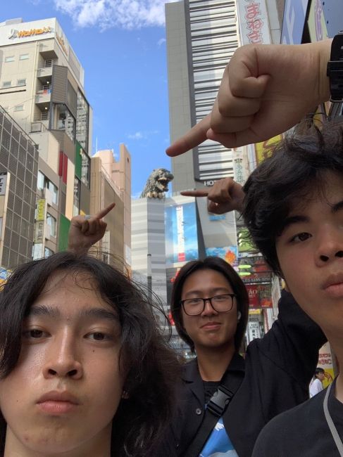 Brian, Aaron, and Graeme in Shinjuku with Godzilla in Shinjuku