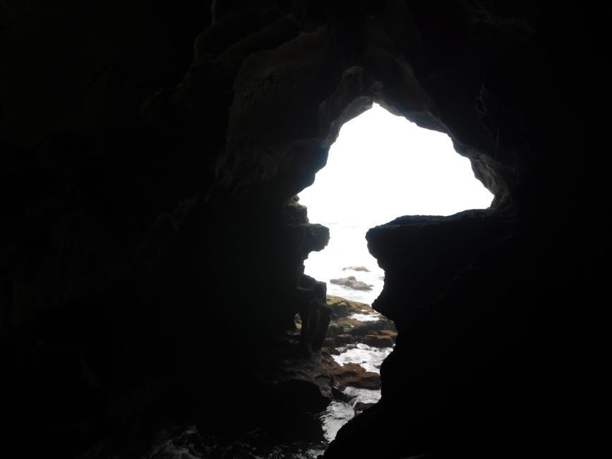 Image looking out to the Atlantic Ocean from inside a cave