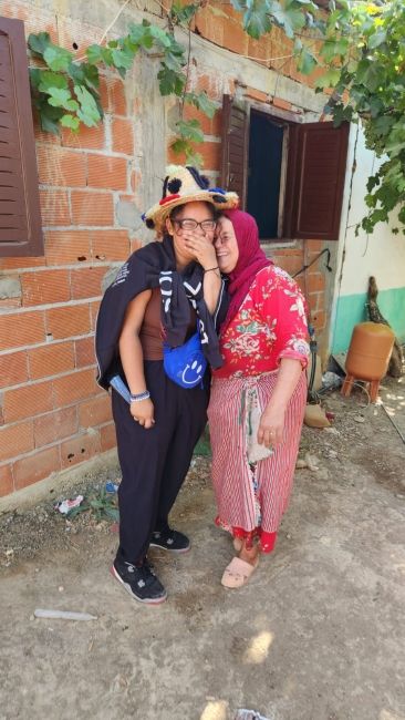 Alexa sharing a moment with a member of the family that welcomed the students into their home