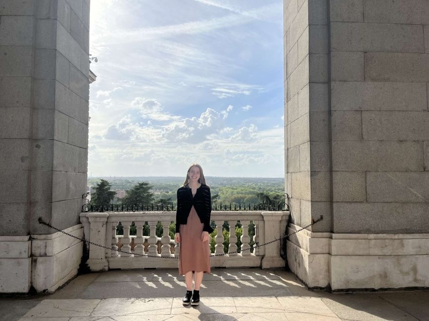 Me, Rose, standing in front of an overlook at the Palacio Real.