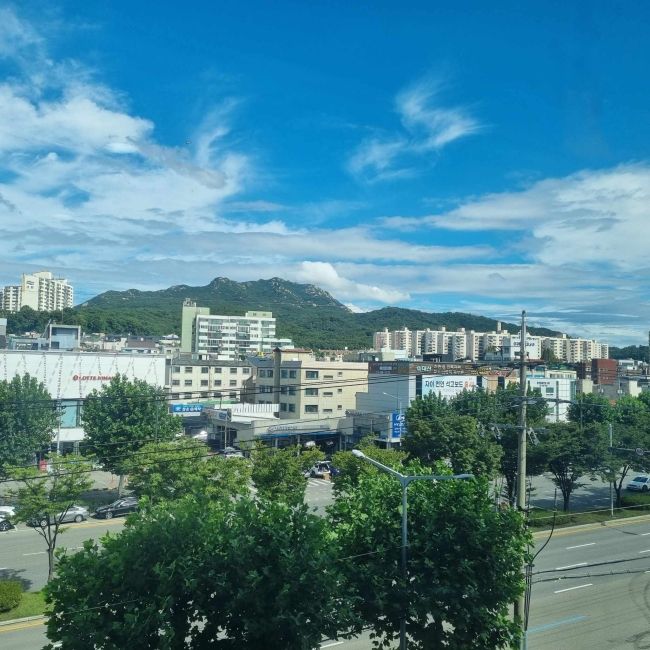 A view of the buildings and mountains in Pyeongchon from my hagwon window.