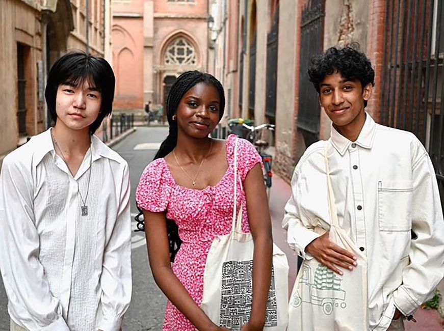 Students posing on a street in Europe
