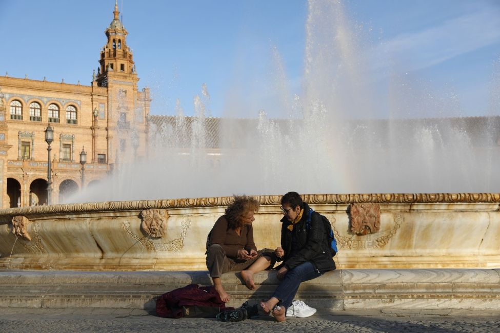 spain plaza de espana people sitting fountain