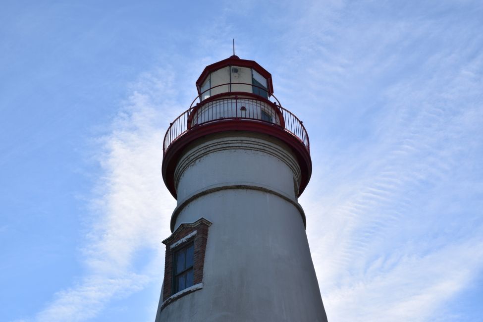 A lighthouse against a blue sky