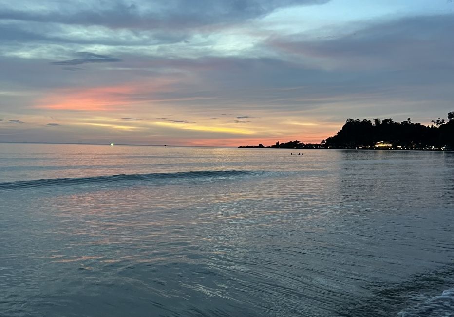 Picture of a beach on Koh Chang with a sunset in the background.