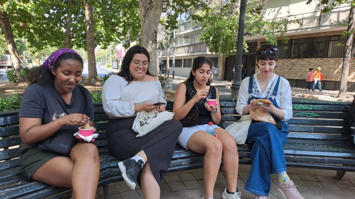 January term students and local Cultural Ambassadors enjoying an ice-cream at a park after a cultural activity