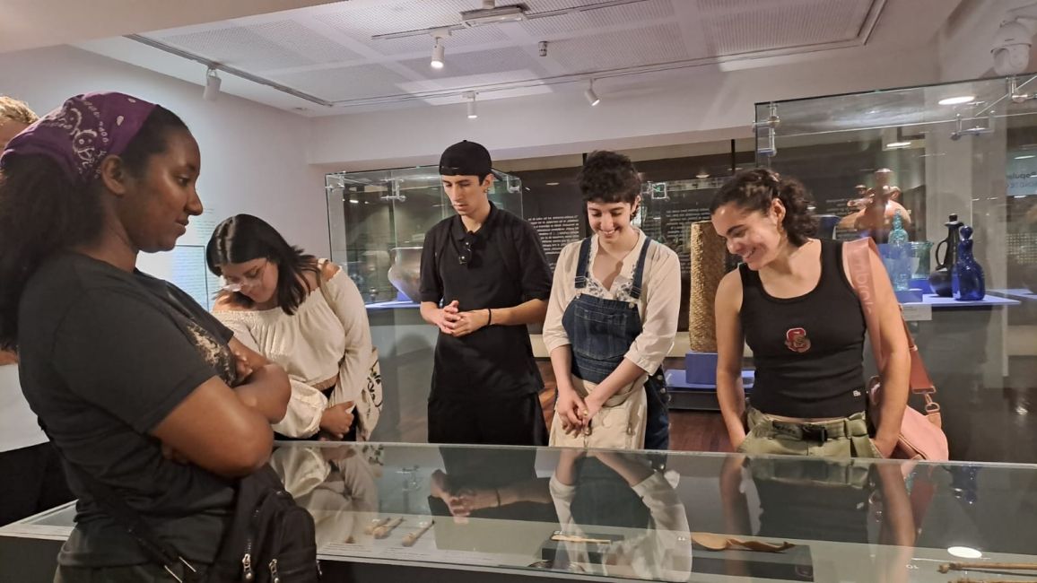 January term students and local Cultural Ambassadors on a cultural activity at an art gallery