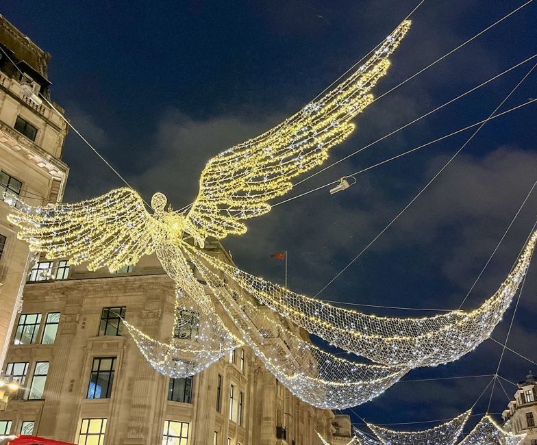 an angel made of lights in the streets of london