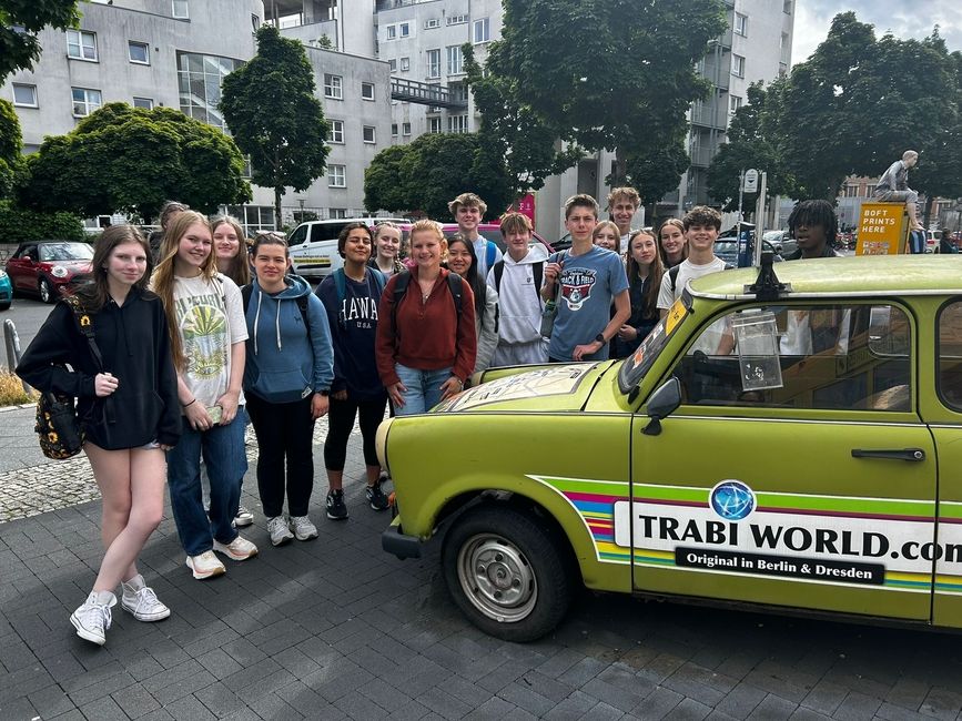 Stopping in front of a display of old East German cars 