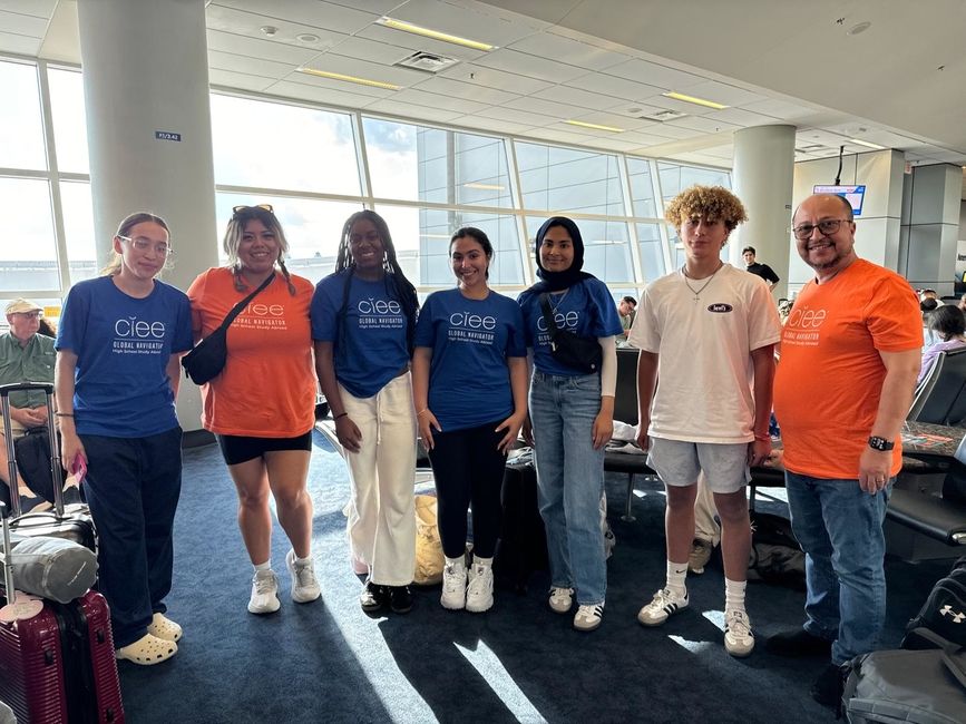 Program leaders with students at the airport