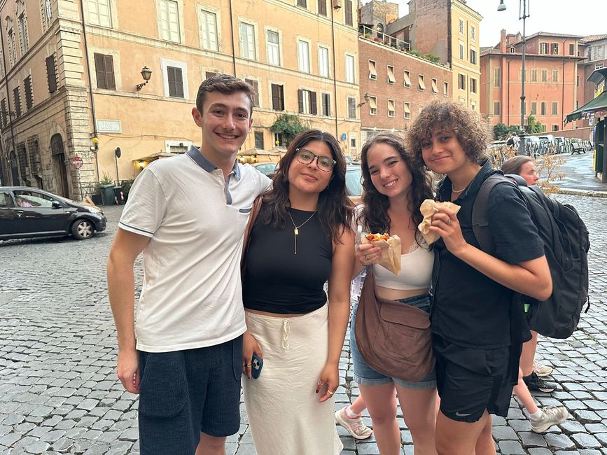 Student participants on the street in Rome eating