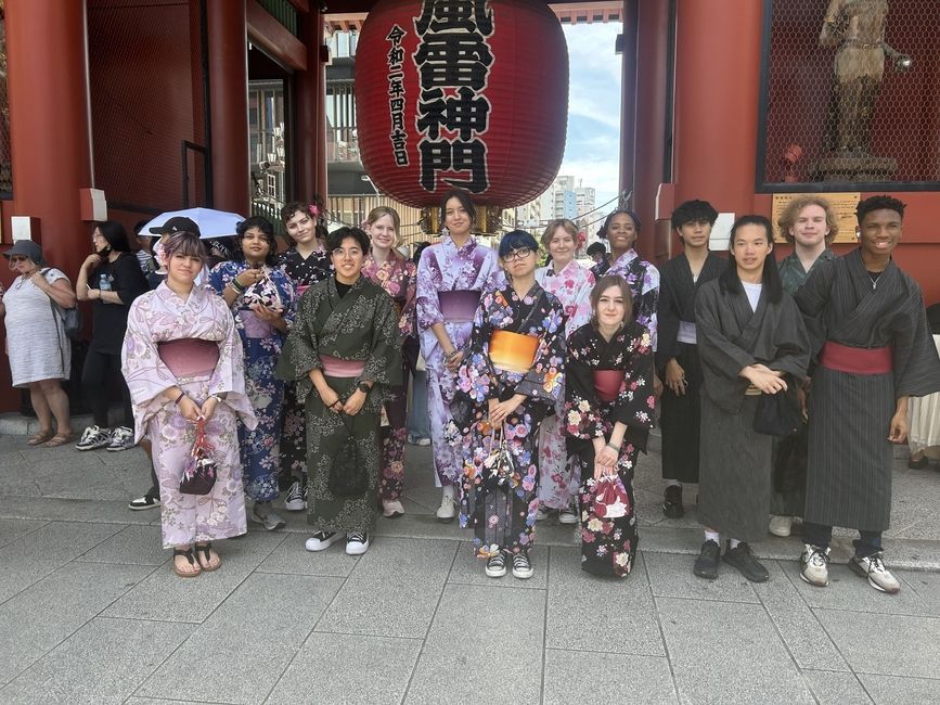 students posing in front of senso-ji temple in tokyo japan