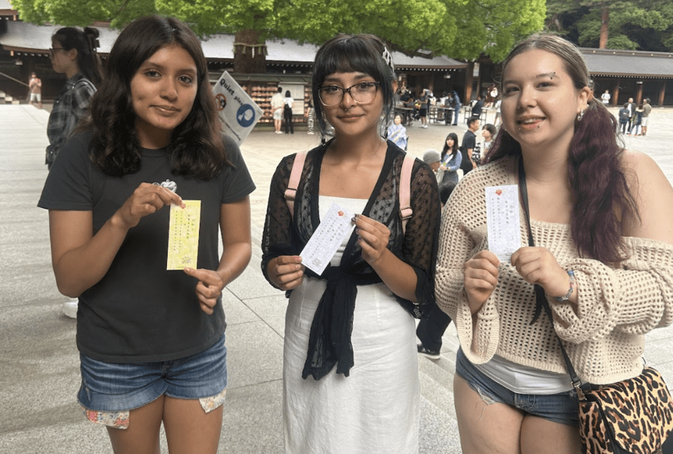 students at shrine with fortunes