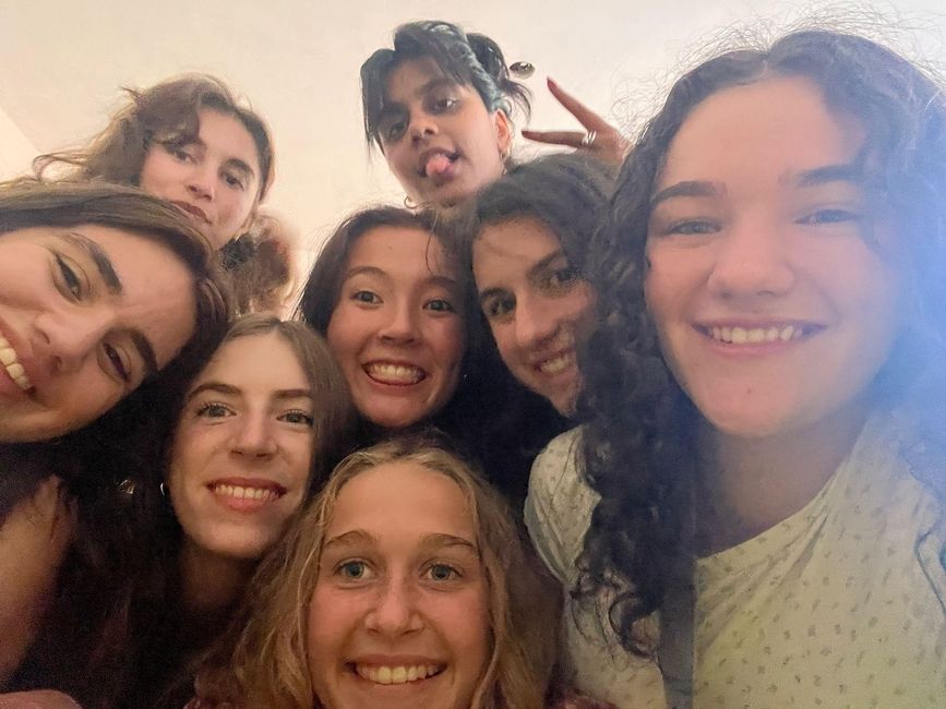 Many students scrunched within the frame of the photo