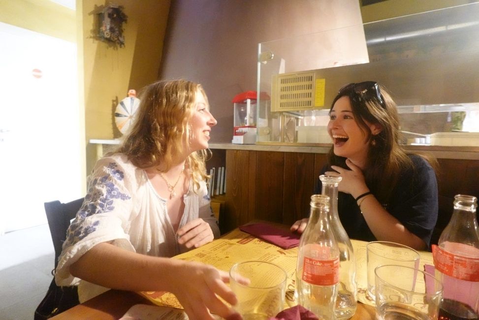 HSSA students laughing while at dinner in Florence