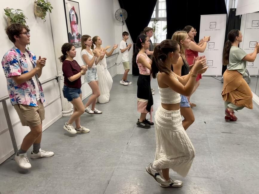 Students clapping and stomping to the Flamenco music