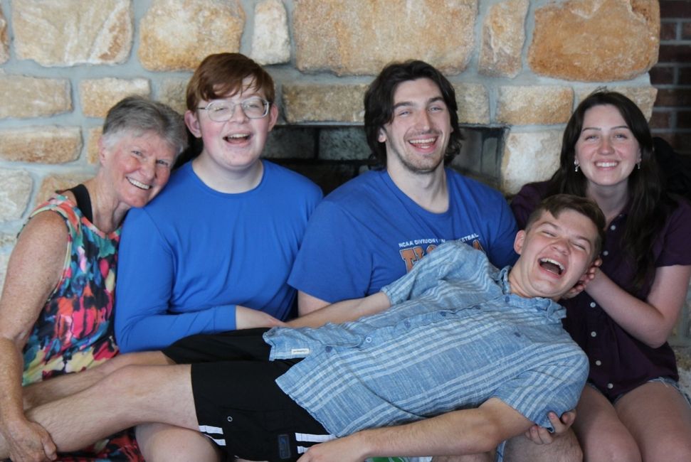 A Family Sits on a Brick Alcove