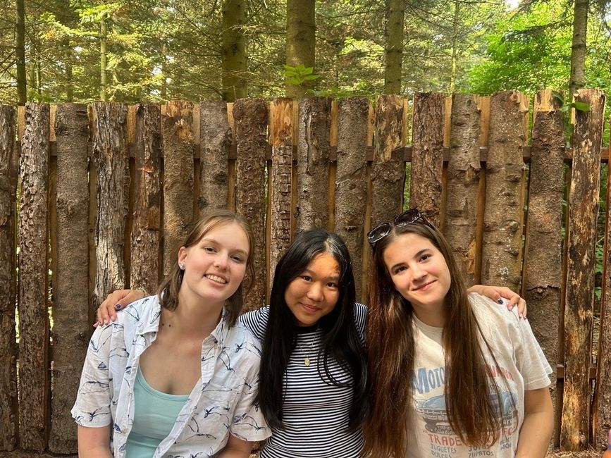 Three students sit after completing the world's largest maze