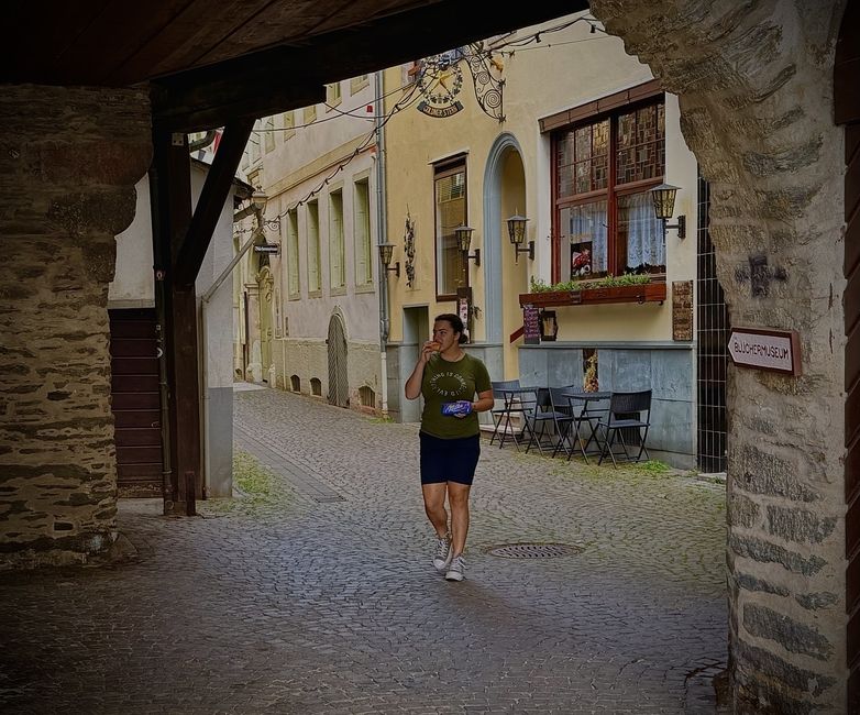 author walking with Milka Schokolade and Brötchen in the winding streets