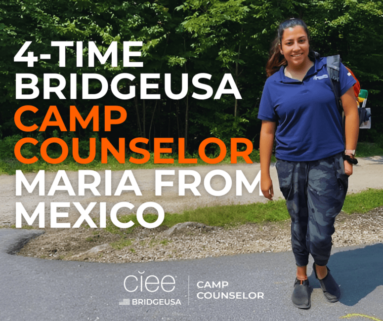Maria M. of Mexico stands in front of the woods at Camp Sno-Mo in New Hampshire.