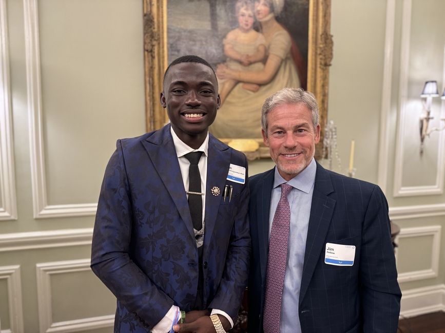 Elijah, left, poses with James P. Pellow, president and CEO of CIEE.