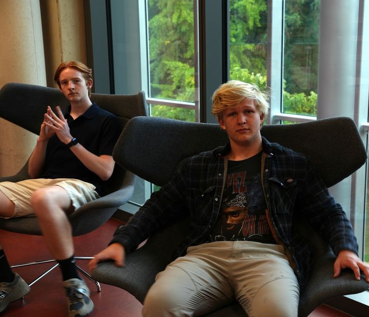 Two CBYX participants sit and ponder.