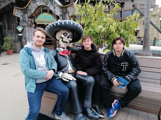 Thomas (second from right) and his host brothers hang out with a ghoulish friend.