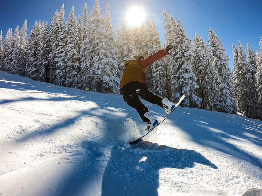 A BridgeUSA participant snowboards down a mountain in Vail, Colorado.
