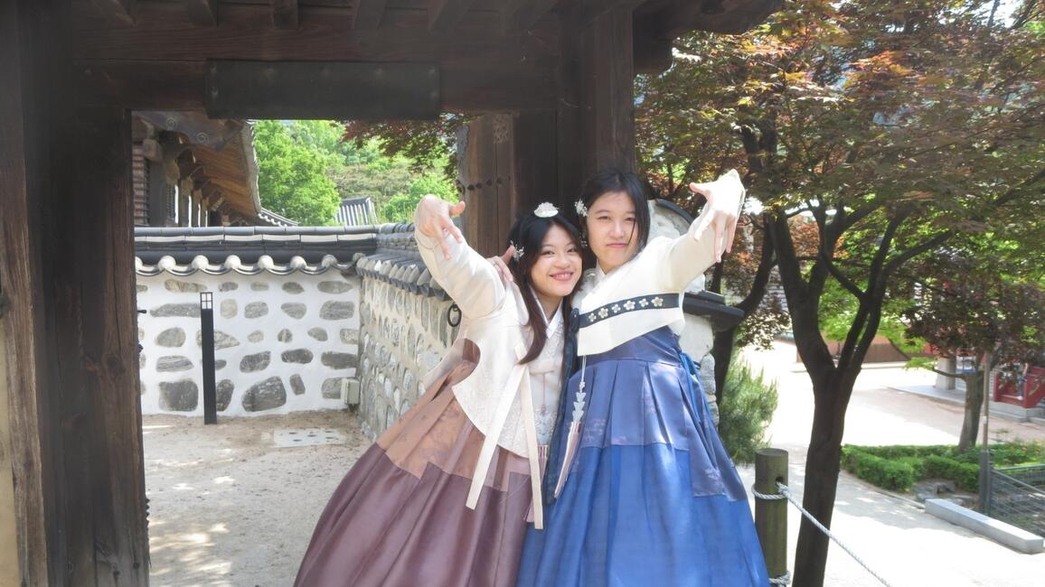 Two friends dressed in Korean hanbok (traditional dress)