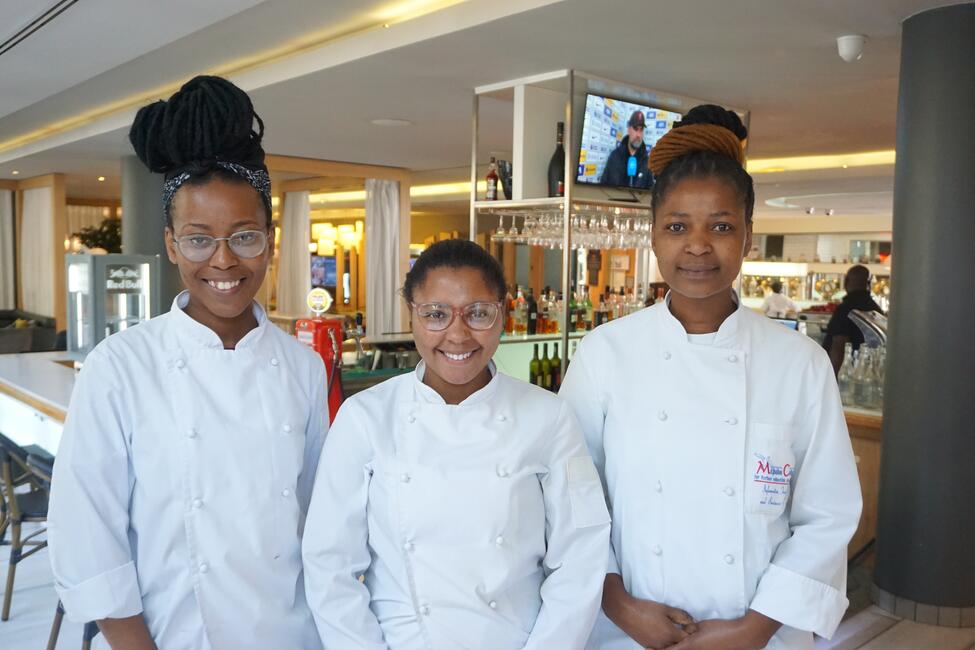 Culinary interns from South Africa pose for a photo.