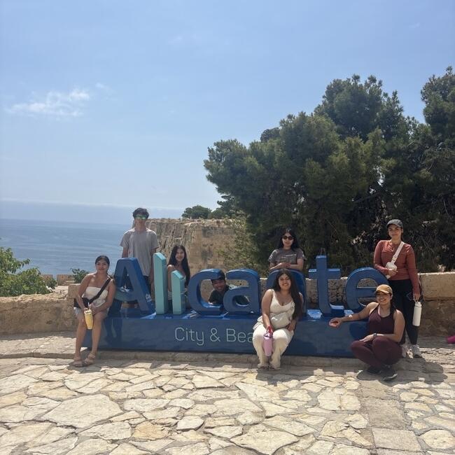 Smiling with the Alicante sign!